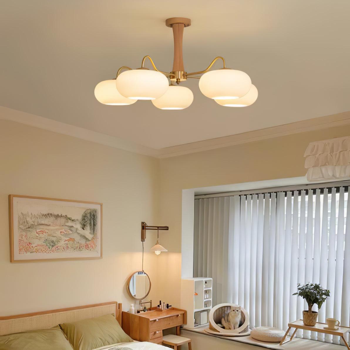 Kaki chandelier above a bed