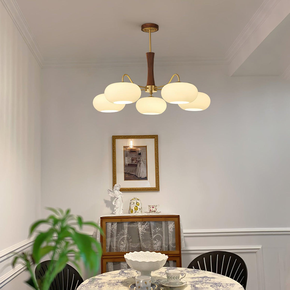 Kaki chandelier in a panelled dining room