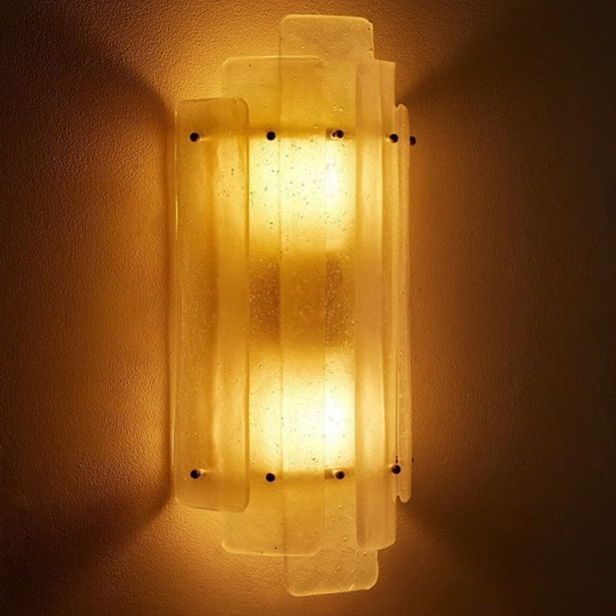 Freya Nordic Glass Wall Light angled view lit