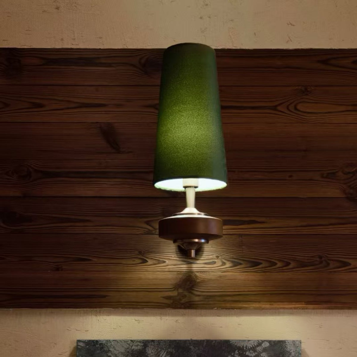Hikari wall light olive green on timber wall