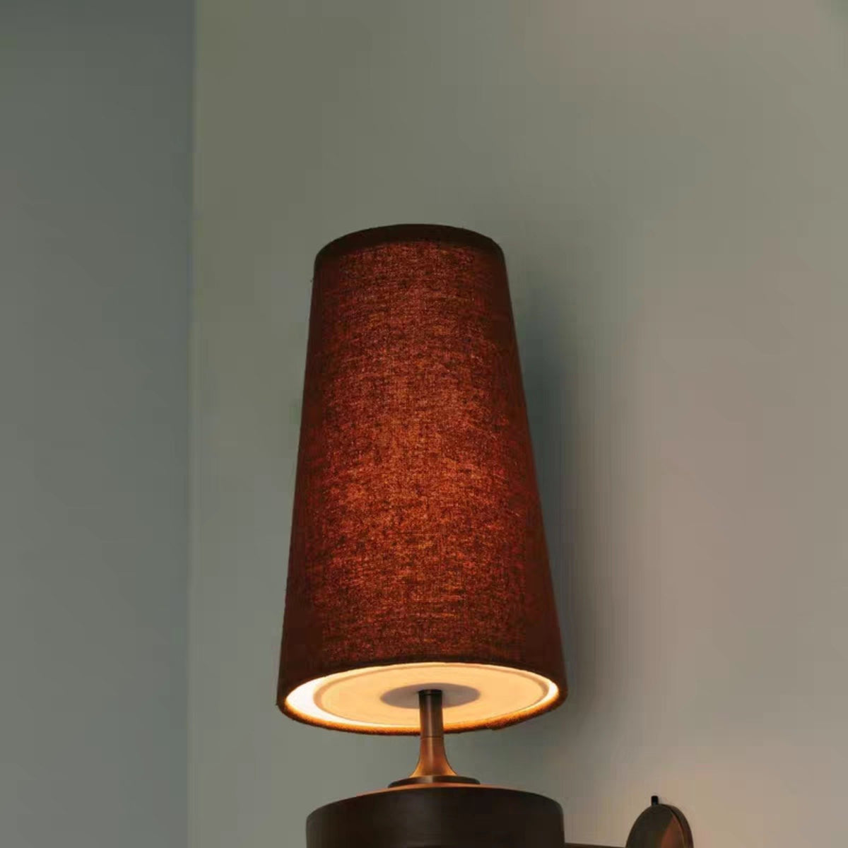 Hikari wall light terracotta red glowing