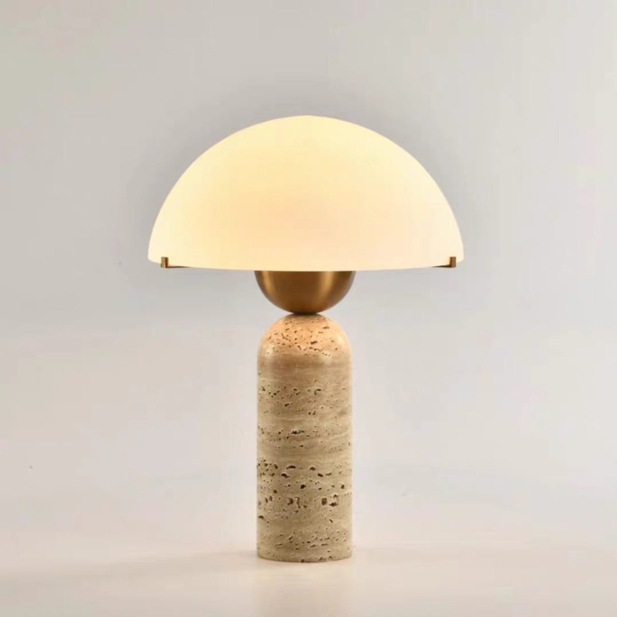 Kinoko travertine table lamp glowing