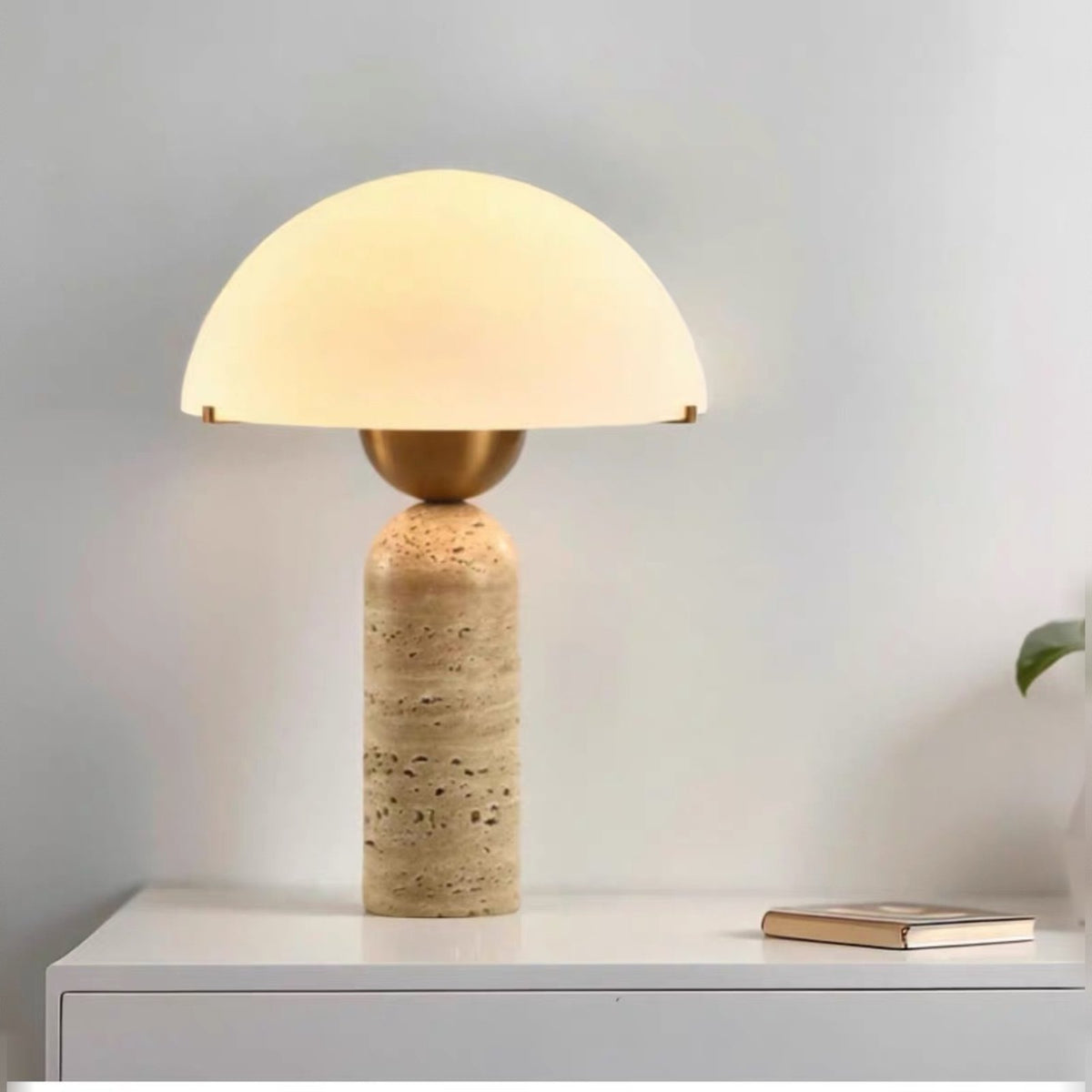 Kinoko travertine lamp on a white sideboard