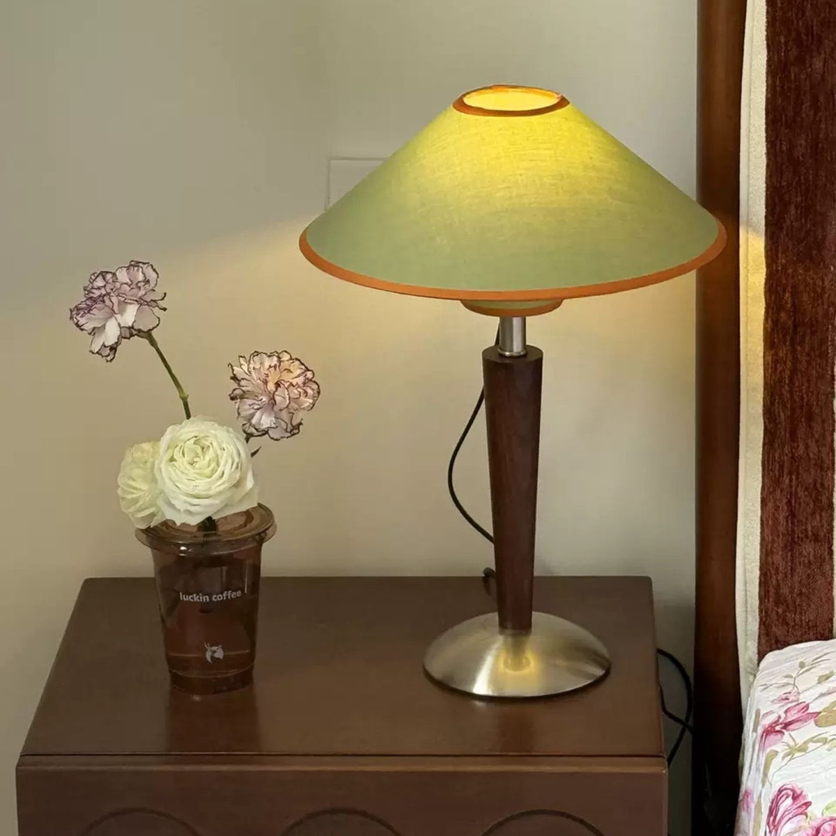 Mori sage green lamp on a bedside chest