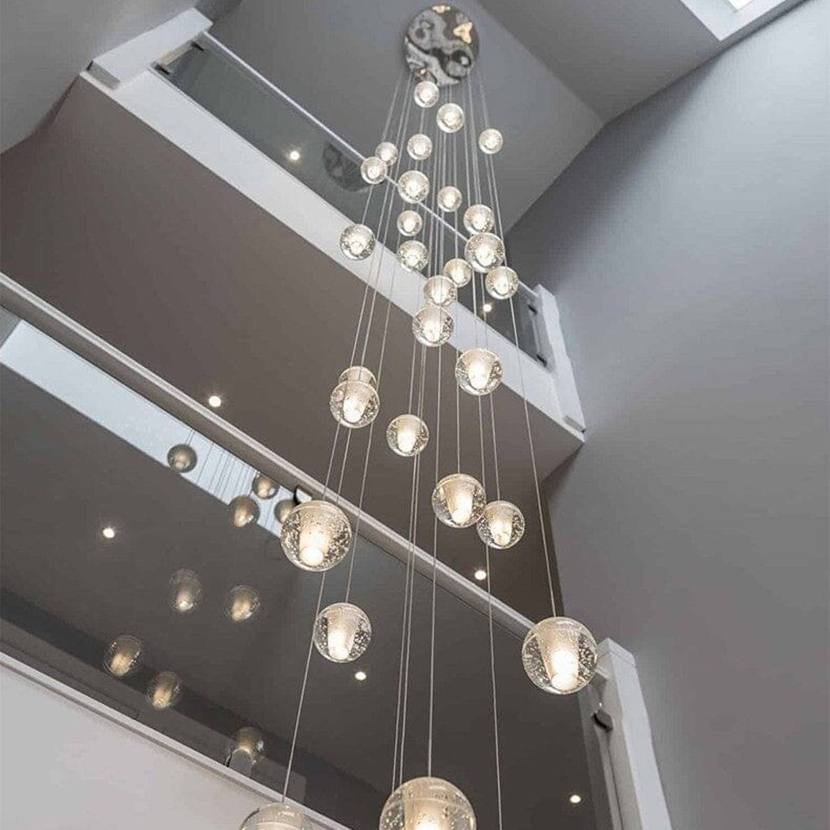 Nimbus chandelier in a modern multi storey void