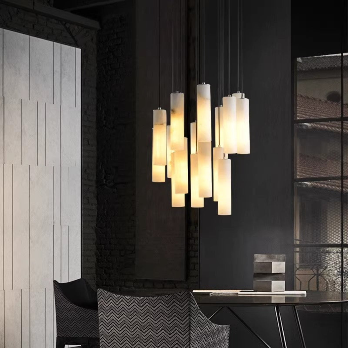 Oria alabaster pendants above a dining corner
