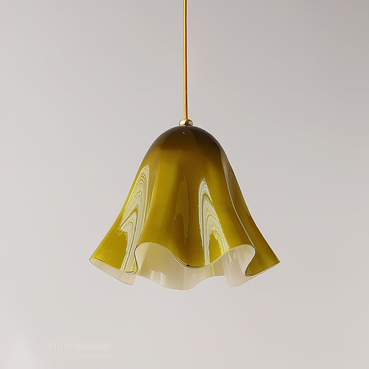 Green glass skirt pendant light close up