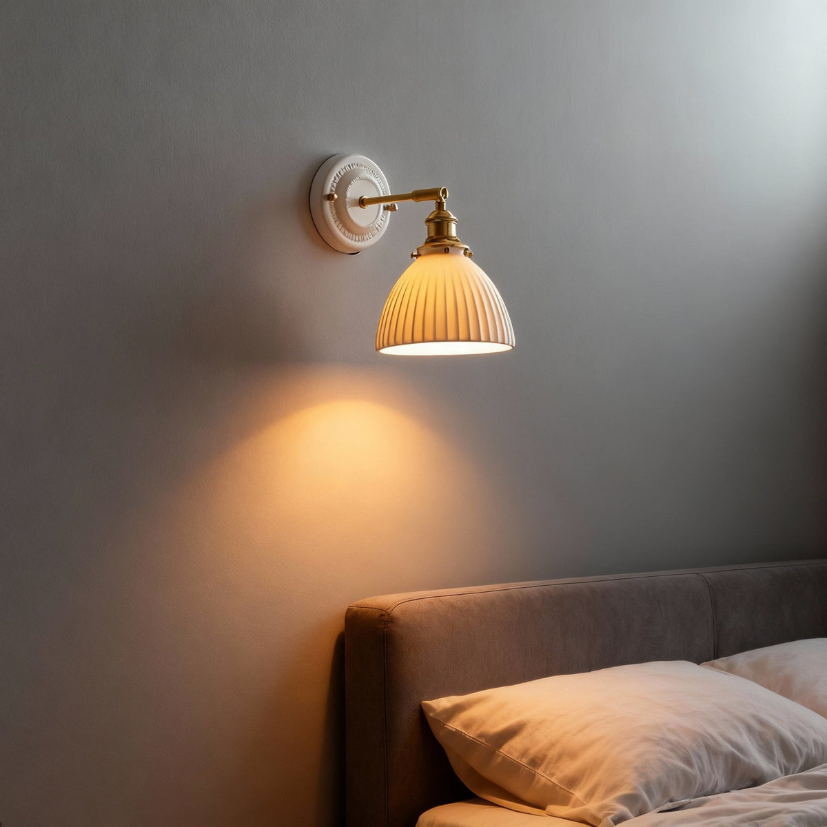 Suzu wall light beside a bed