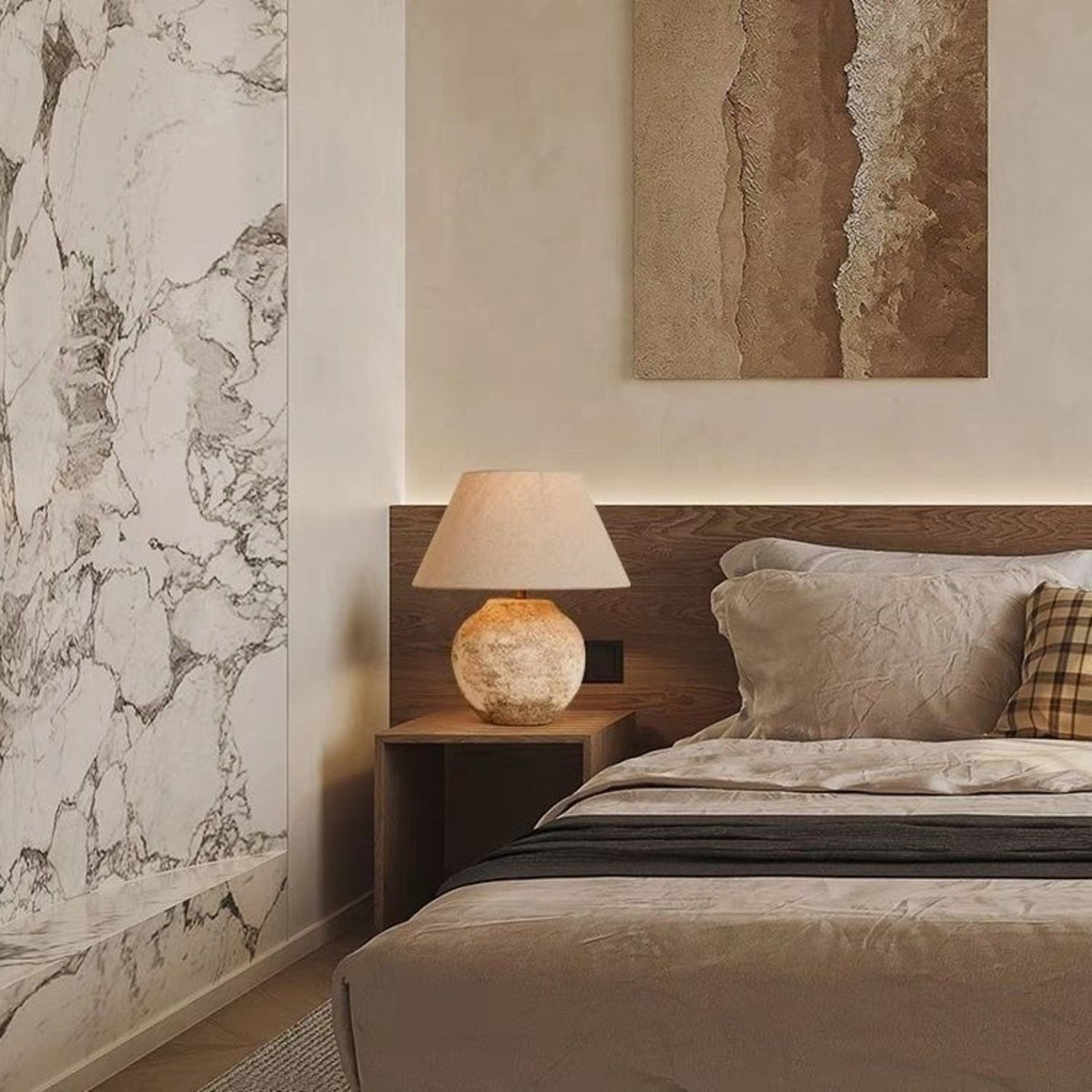 Tsumugi table lamp in a marble accent wall bedroom
