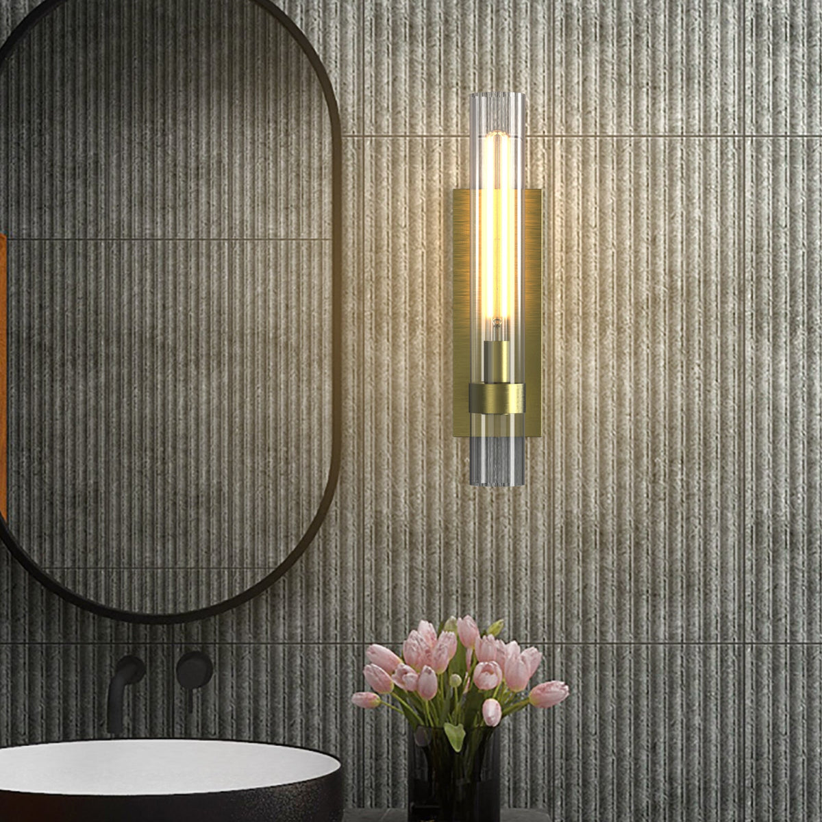 Brass glass wall light in a bathroom