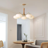 Kaki chandelier above a round dining table