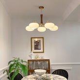 Kaki chandelier in a panelled dining room