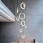 Ylva ring chandelier glowing in an entry void