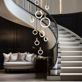 Ylva ring chandelier in a curved staircase