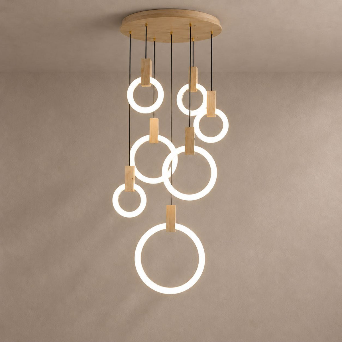 Ylva ring chandelier against a plaster wall