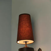 Hikari wall light terracotta red glowing