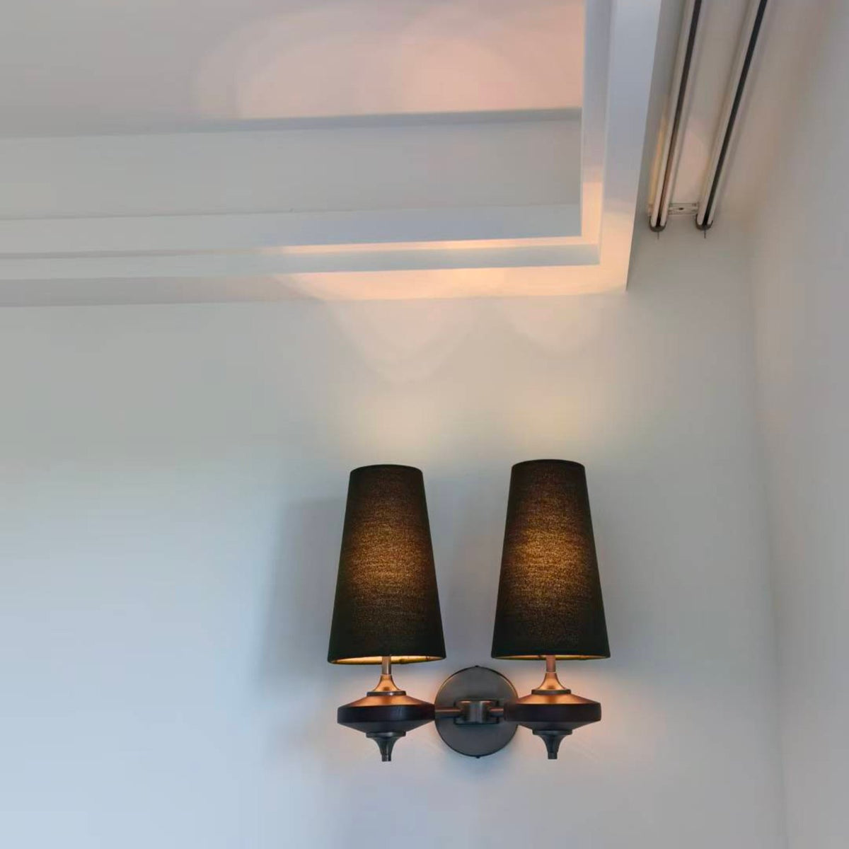 Hikari double head wall light in a living room