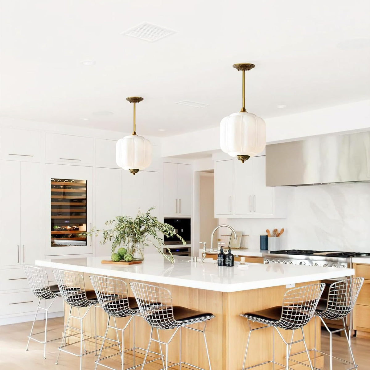 Kabocha pumpkin pendants over a kitchen island