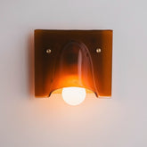 Linnea amber single head wall light glowing warm