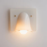 Linnea cream single head wall light glowing warm