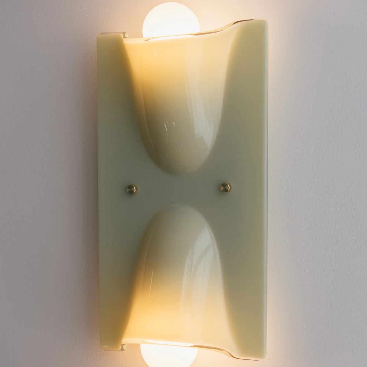 Linnea sage green double head wall light glowing warm