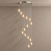 Nimbus spiral bubble glass chandelier against a plaster wall