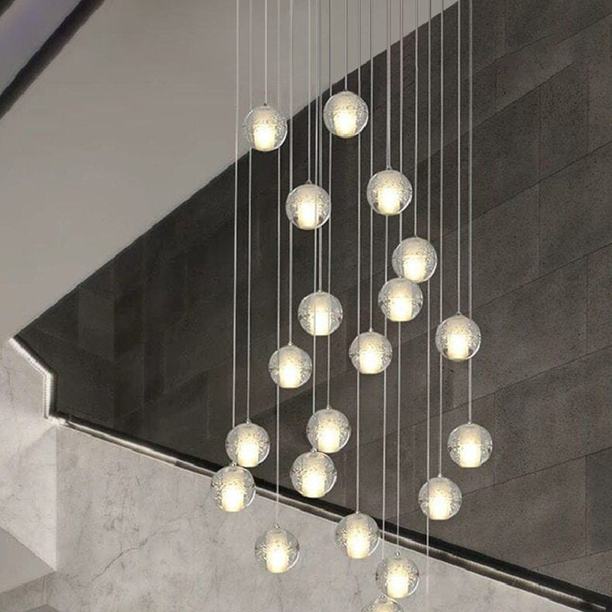 Nimbus glass spheres falling through a stairwell
