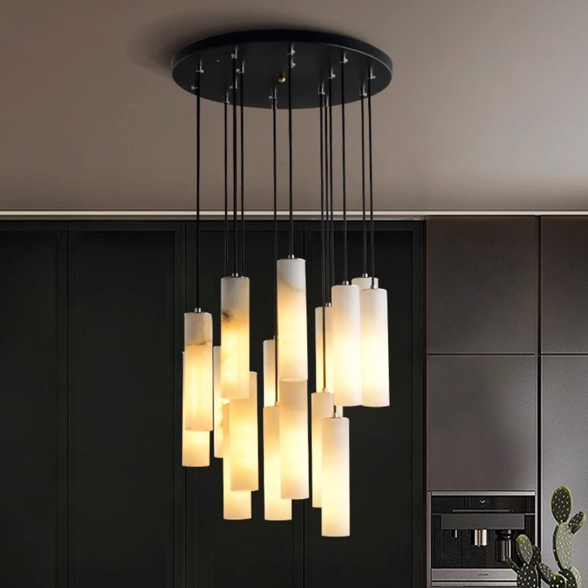 Oria alabaster cluster glowing in a dark kitchen