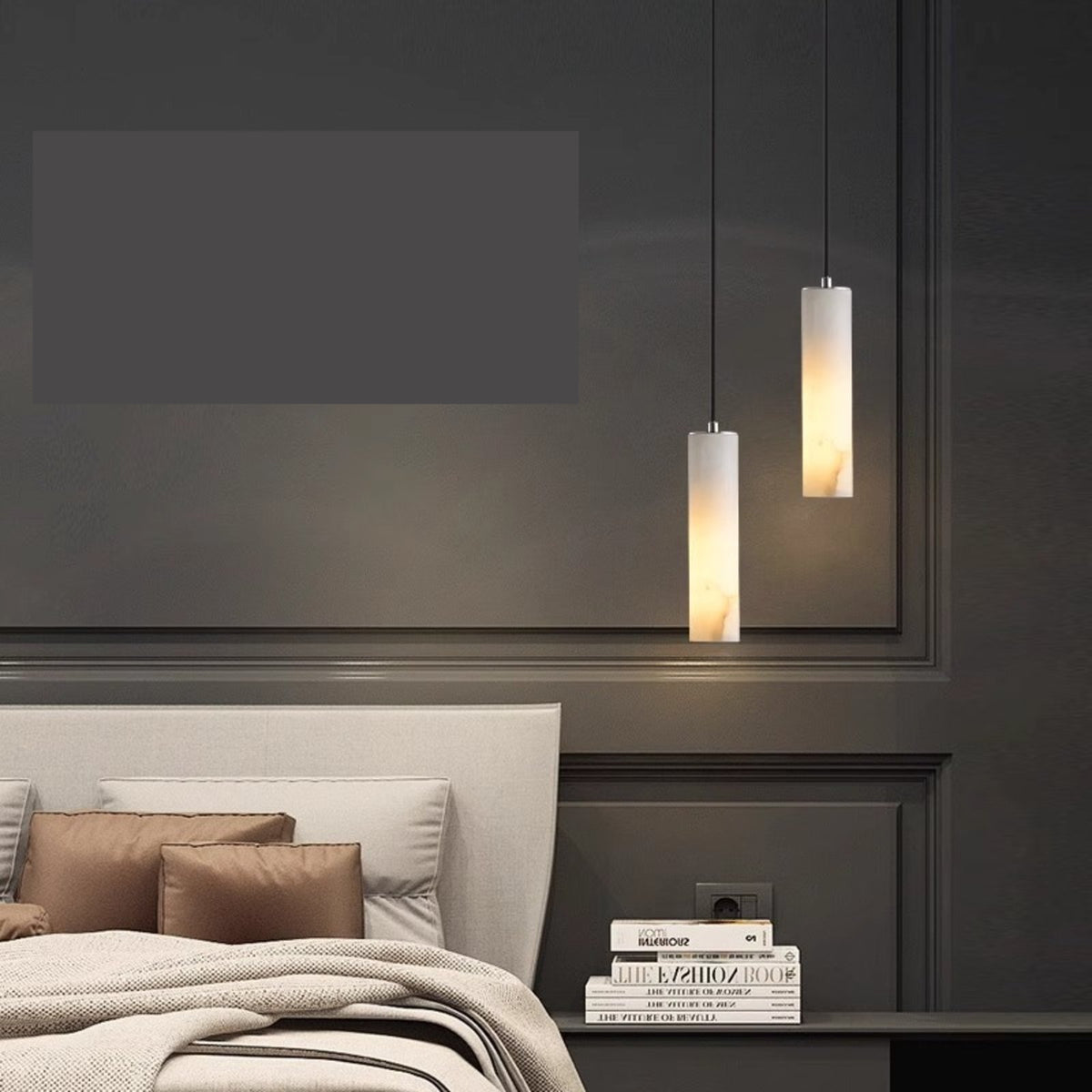 Oria single alabaster pendants beside a bed