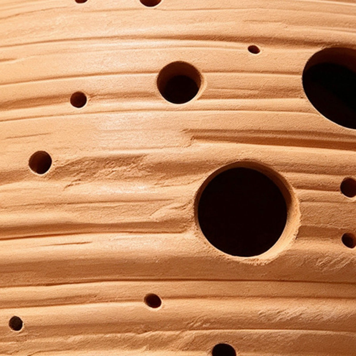 Hand-perforated terracotta texture, globe