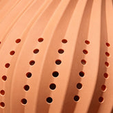 Swirled terracotta ribs and perforations