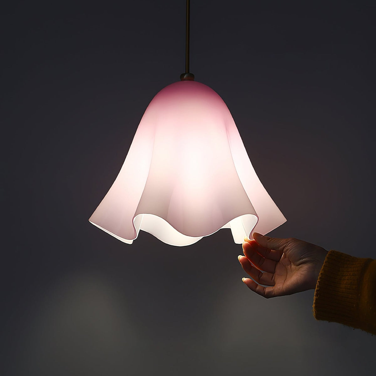 Purple glass skirt pendant light glowing