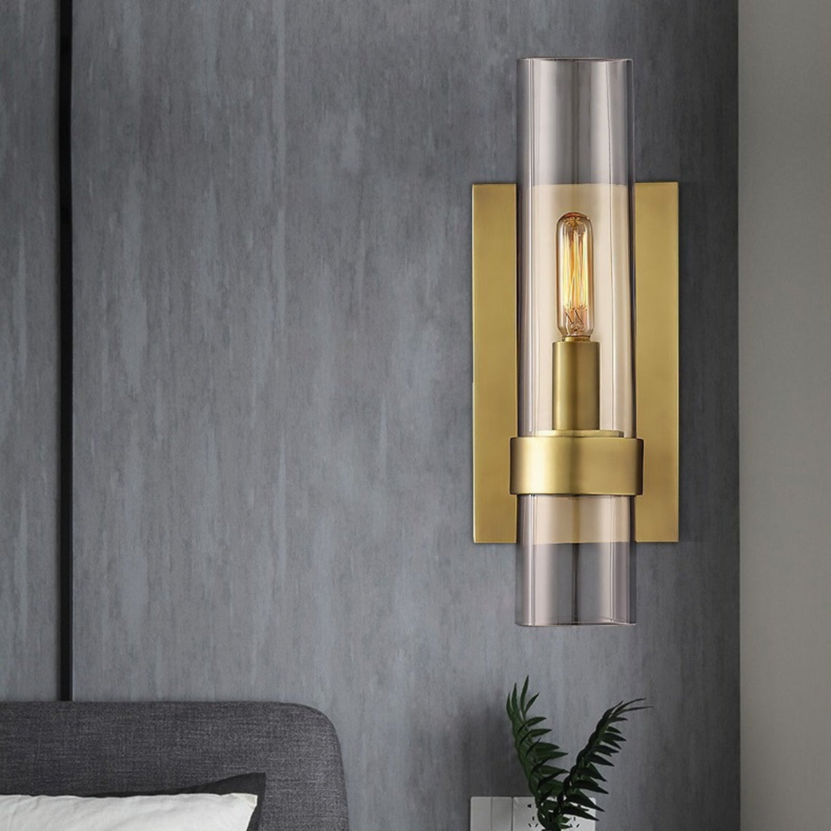 Tessa brass sconce on a grey bedroom wall