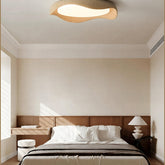 Nami flush mount in a warm-toned bedroom