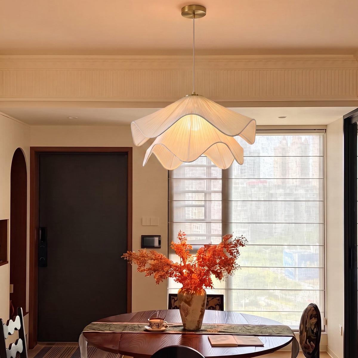 Radiance of Serenity wavy fabric pendant light above a dining table