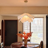 Radiance of Serenity wavy fabric pendant light above a dining table