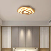 Sazanami natural wood ceiling light above a bed