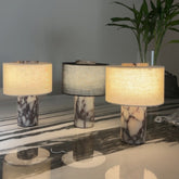 Three Yoru marble lamps on a table