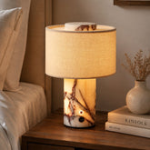 Yoru glowing marble lamp on a bedside table